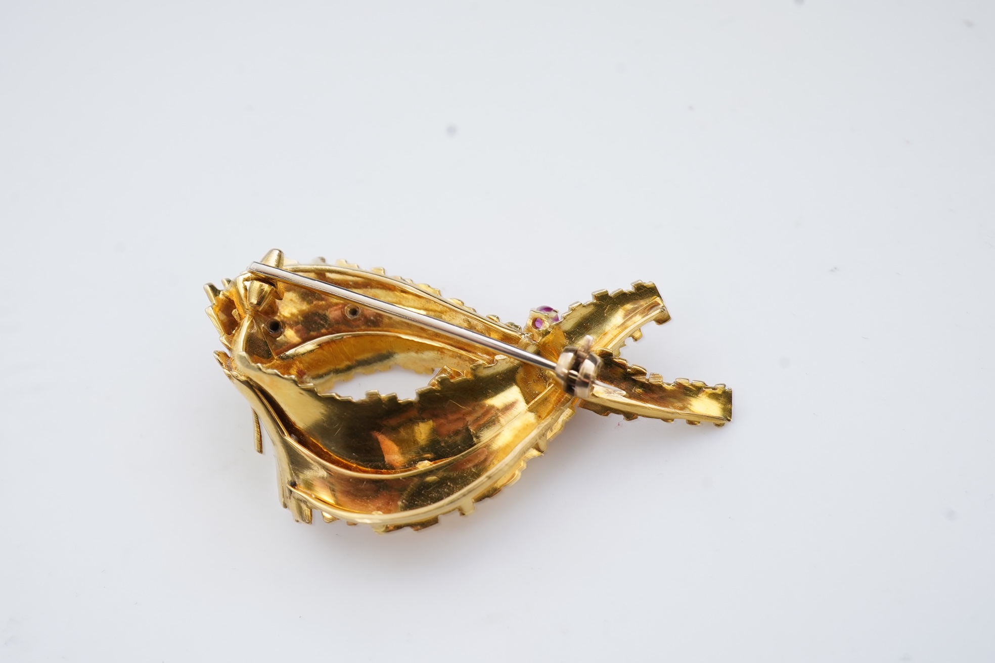 A gold, ruby and diamond brooch, circa 1965